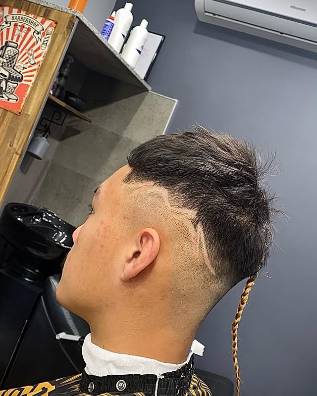 Mullet with skin fade and hair design